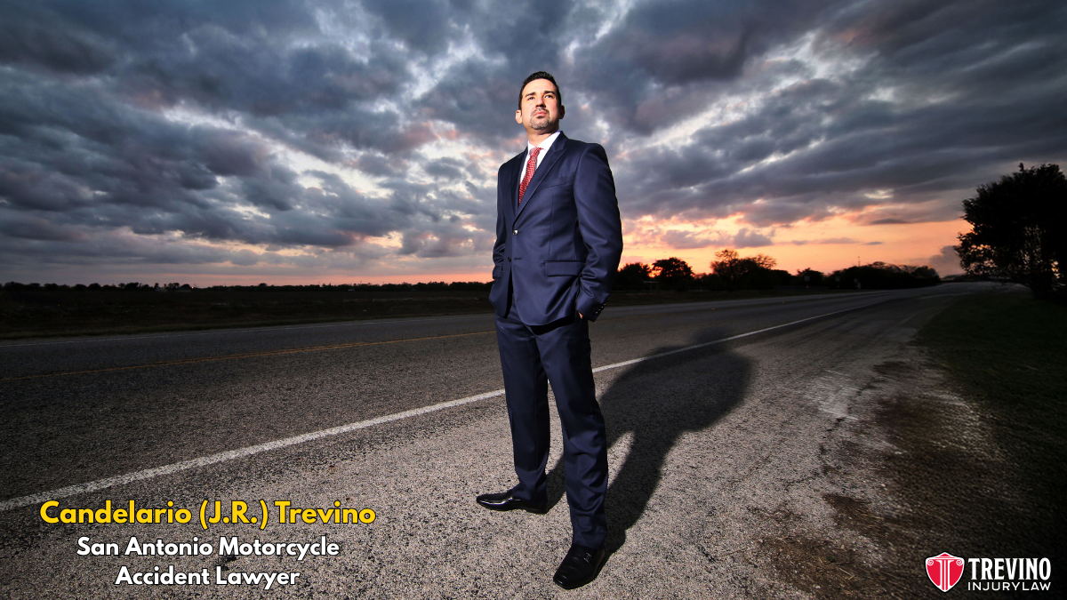 Best San Antonio motorcycle accident lawyer. Attorney Candelario (J.R.) Trevino wearing a suit standing on a road in San Antonio, ready to offer guidance as a trusted Motorcycle Accident Lawyer.